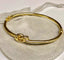 14K Gold Polished Puffed Love Knot Bangle 7inches 9.5mm thick